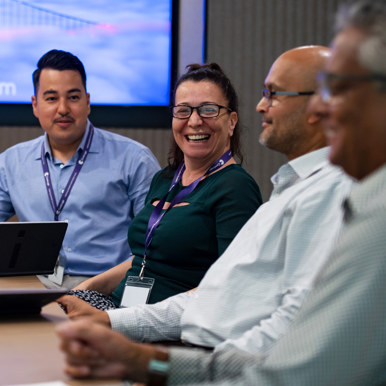 Diverse group of employees in board room